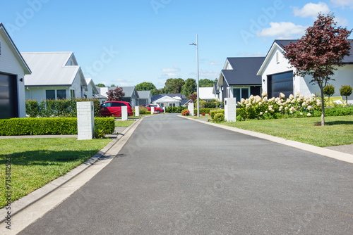 Suburban homes lining new orderly street. photo