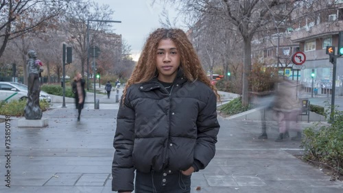 Zoom in time lapse of a pretty woman with long curly hair. Modern lifestyle, people and society concept