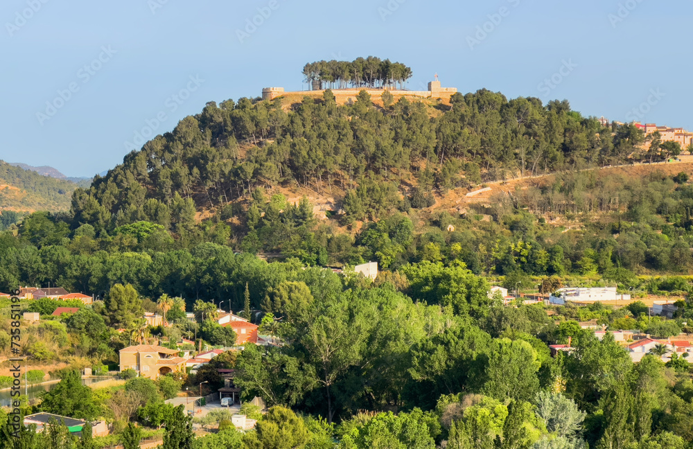 Rural landscape in Segorbe town. Farmhouse at vegetable field. Spain farmland. Cultivation of crops, production of food in countryside. House and Villa in farm field.