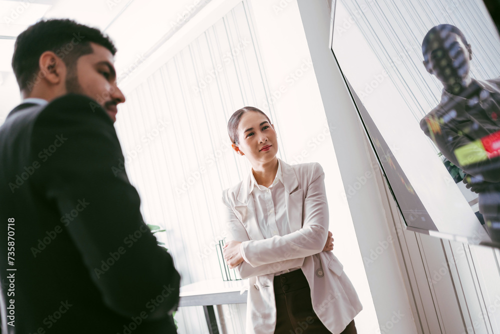 A professional successful Asian businesswoman presents an investment of stock or crypto graph on the monitor screen while meeting. Stock or crypto trade information graph chart on a monitor screen. A professional successful Asian businesswoman presents an investment of stock or crypto graph on the monitor screen while meeting. Stock or crypto trade information graph chart on a monitor screen.