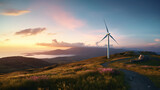 A wind turbine on top of a hill with a sunset