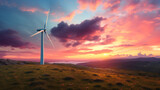 A wind turbine on top of a hill with a sunset