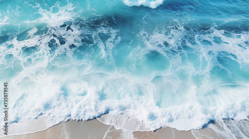 Aerial view of ocean waves. Blue water background.