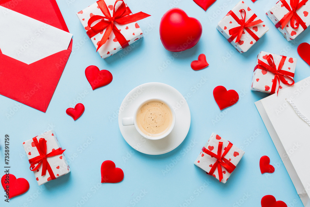 Mug coffee and gift box on colored background. Flat lay composition. Holiday concept Mug coffee and gift box on colored background. Flat lay composition. Holiday concept