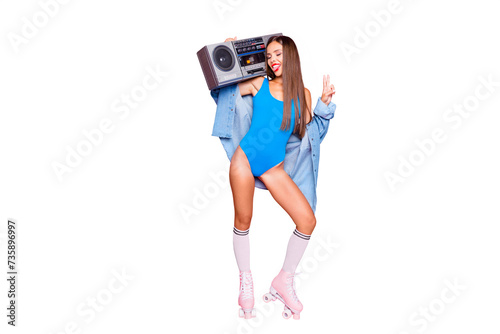 Party mood! Full-size portrait of beautiful brunette girl on roller skates with a boombox showing v-sign and laughing isolated on bright pink background