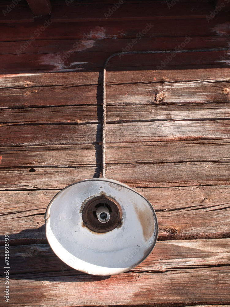 old lamp without bulb on wooden log wall exterior old lamp without bulb on wooden log wall exterior