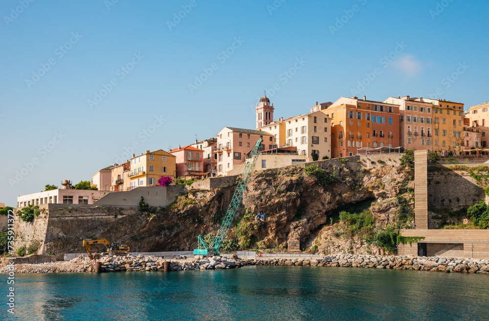 Corsica, Bastia panoramic view of Porto Vecchio harbor, Corsica island, France. Old town with colorful facade and fortress beautiful coastline.