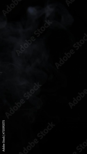vertical footage of smoke dark background