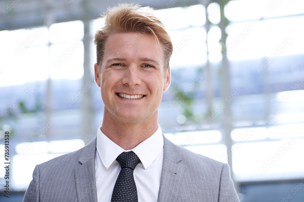Smile, portrait and businessman in office with ambition, positive and professional worker in formal suit. Sales manager, happy and face in closeup in corporate job, trust and company mission at work Smile, portrait and businessman in office with ambition, positive and professional worker in formal suit. Sales manager, happy and face in closeup in corporate job, trust and company mission at work