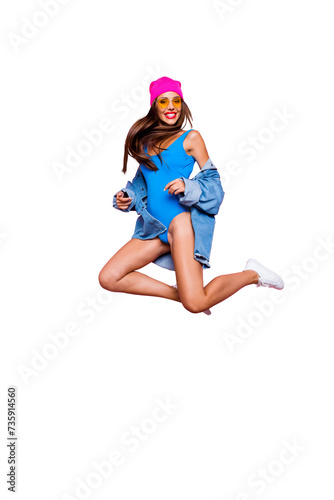 Vertical full size length body studio photo portrait of cheerful attractive pretty rejoicing confident funny fancy girl jumping up isolated bright color vivid shinny background