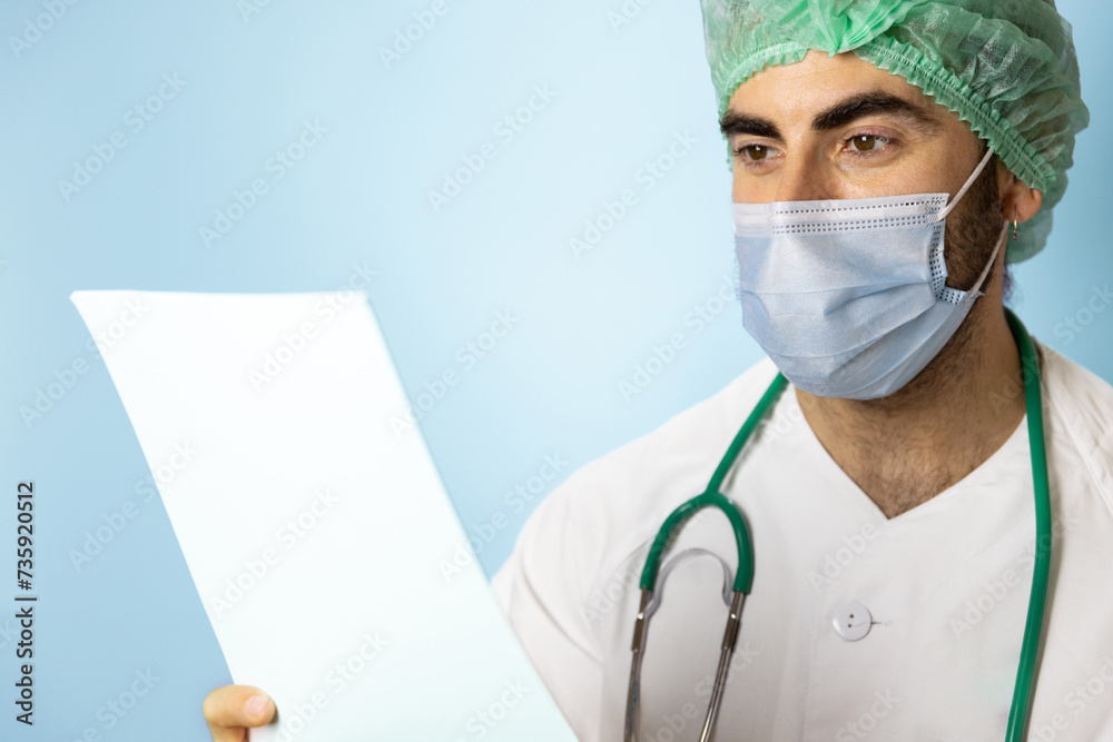 portrait of a nurse in white coat doctor with stethoscope turquoise blue background, with smiling face, making joke, reading reports portrait of a nurse in white coat doctor with stethoscope turquoise blue background, with smiling face, making joke, reading reports