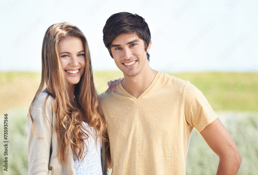Couple, portrait and smile in nature, love and care in relationship on outdoor date. Happy people, together and relax on holiday or vacation, bonding and romance on adventure and travel for getaway