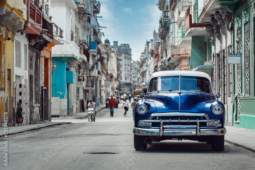 Shiny blue retro car parked on the street of Havana, Cuba photo