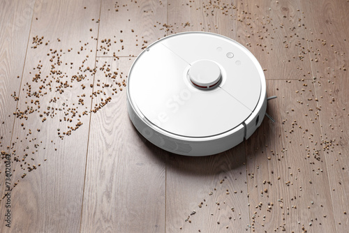 Smart robot vacuum cleaner removes scattered debris from the laminate floor.