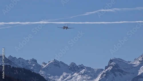 High End Business Jet Final Approach mountains snow covered vacation holiday landing arrival arriving
