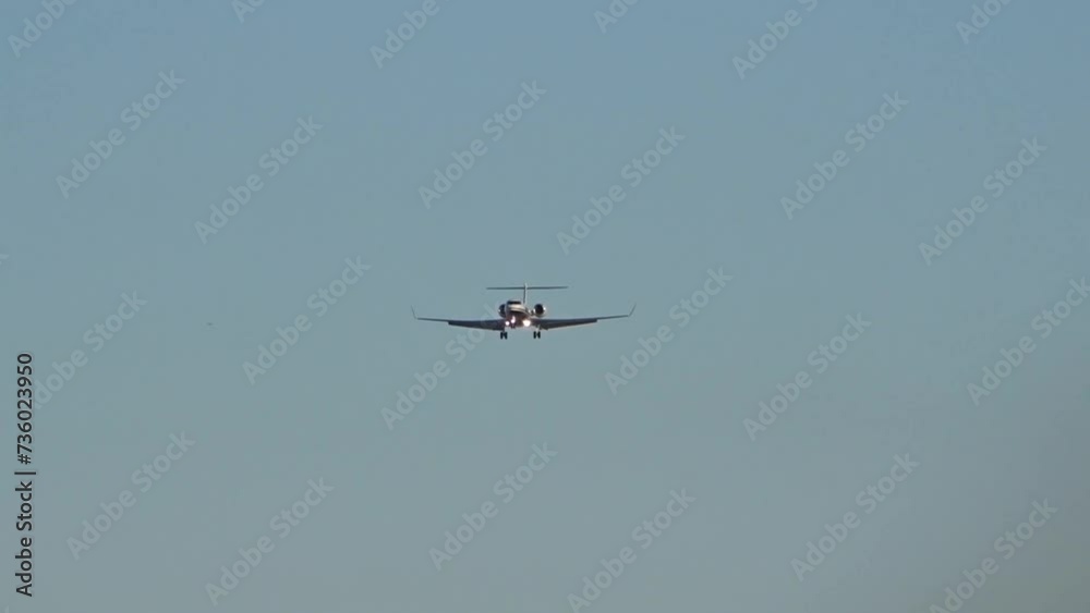 High end business jet head on front final approach into airport High end business jet head on front final approach into airport
