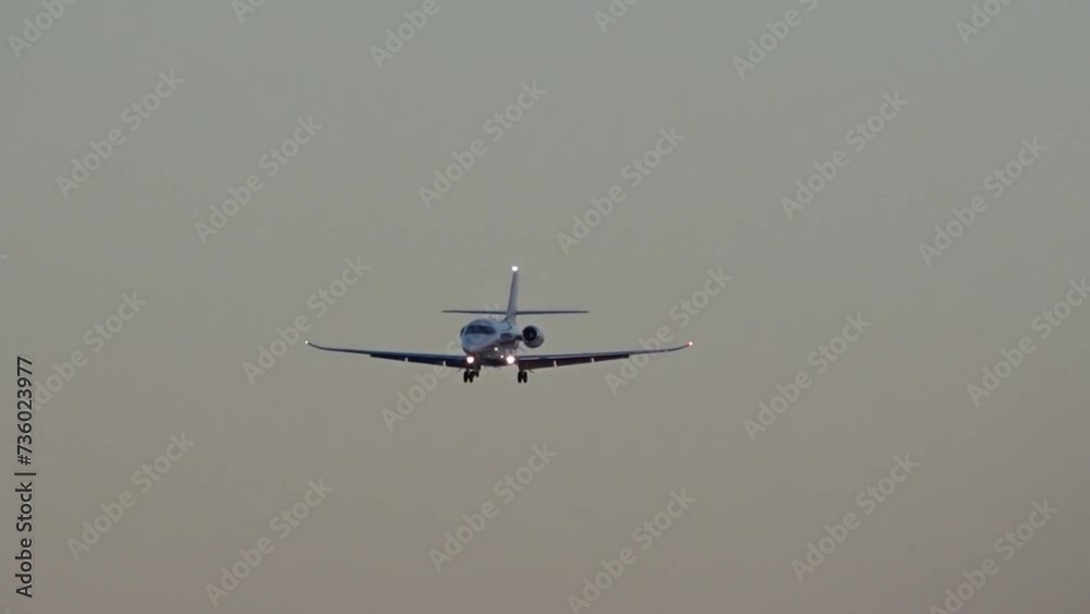 midsize business jet flying approach into airport dusk dawn midsize business jet flying approach into airport dusk dawn