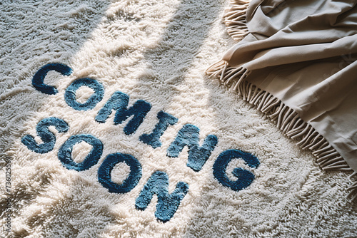Coming soon text on white carpet with soft focus background, vintage tone