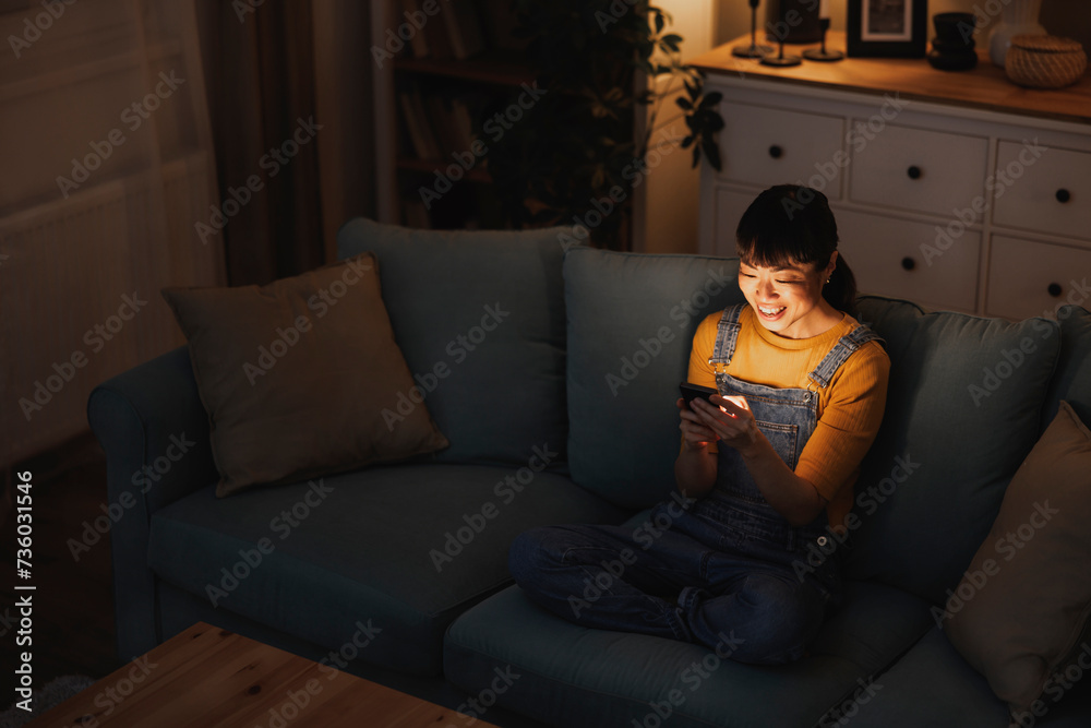 Woman chatting online with friends using smart phone Woman chatting online with friends using smart phone