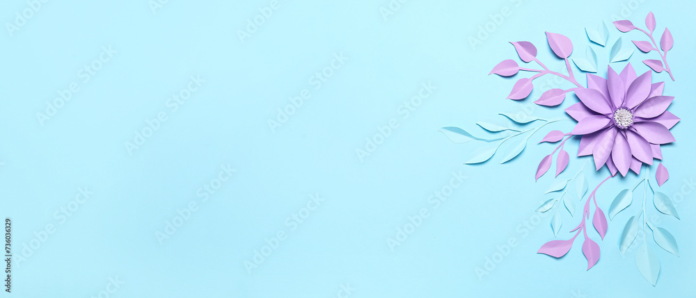Beautiful paper flower and leaves on light blue background with space for text