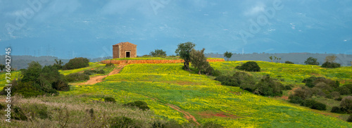 OId farm house ruins scattered around the interior of the Algarve region of Portugal photo