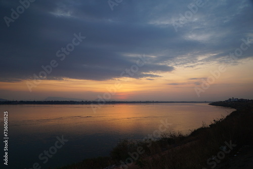 The orange glow of the sunset along the beautiful river