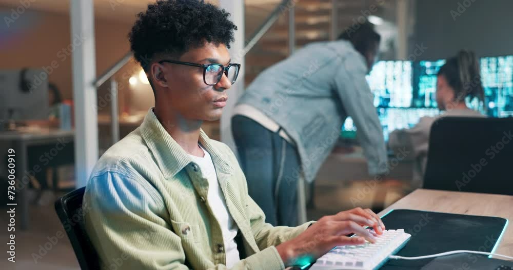 Computer screen, engineer and coding on keyboard in office and productivity on futuristic technology. Man, writing or working on gaming programming on neon mousepad and glasses with reflection of pc