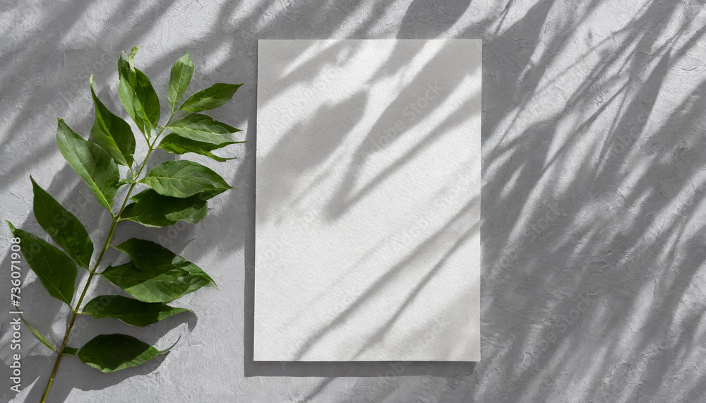 vertical sheets of textured white paper against a soft gray table background. the natural light creates subtle shadows from an exotic plant, enhancing the mockup overlay in a horizontal - obrazy, fototapety, plakaty 