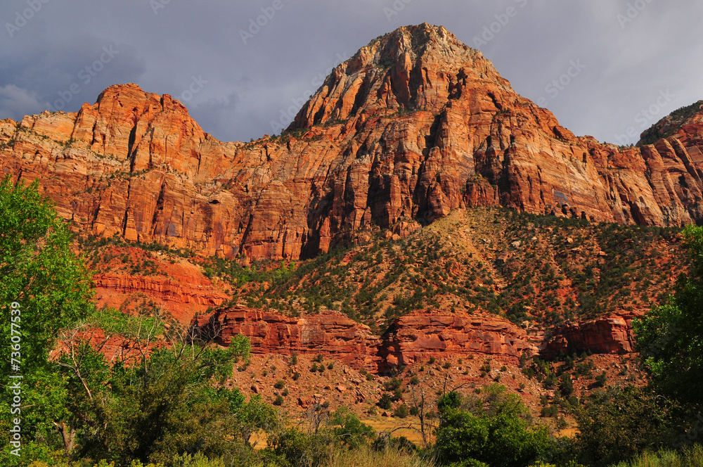 Sandstone peaks towering above the valley on the approach to the Narrows of the Virgin river, Zion National Park, Utah, Southwest USA.