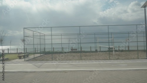 Wallpaper Mural Football and basketball courts by the sea, view from a moving car. Torontodigital.ca