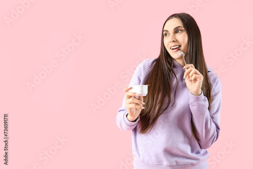 Thoughtful young woman with...
