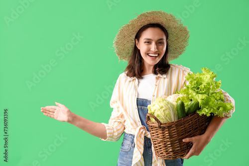 Female farmer with basket o...