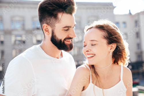 Smiling beautiful woman and her handsome boyfriend. Woman in casual summer clothes. Happy cheerful family. Female having fun. Couple posing in street at sunny day. Having tender moments