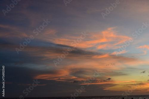 Scenic view of colourful sky during sun setting in Caribbean sea. © Lara Red