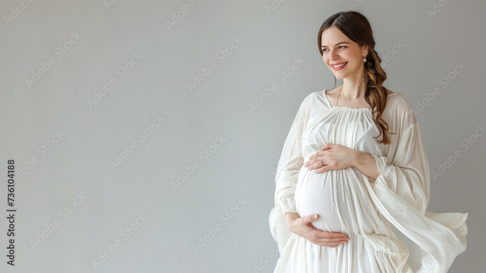Caucasian pregnant woman with pregnancy belly, in soft white clothes Caucasian pregnant woman with pregnancy belly, in soft white clothes