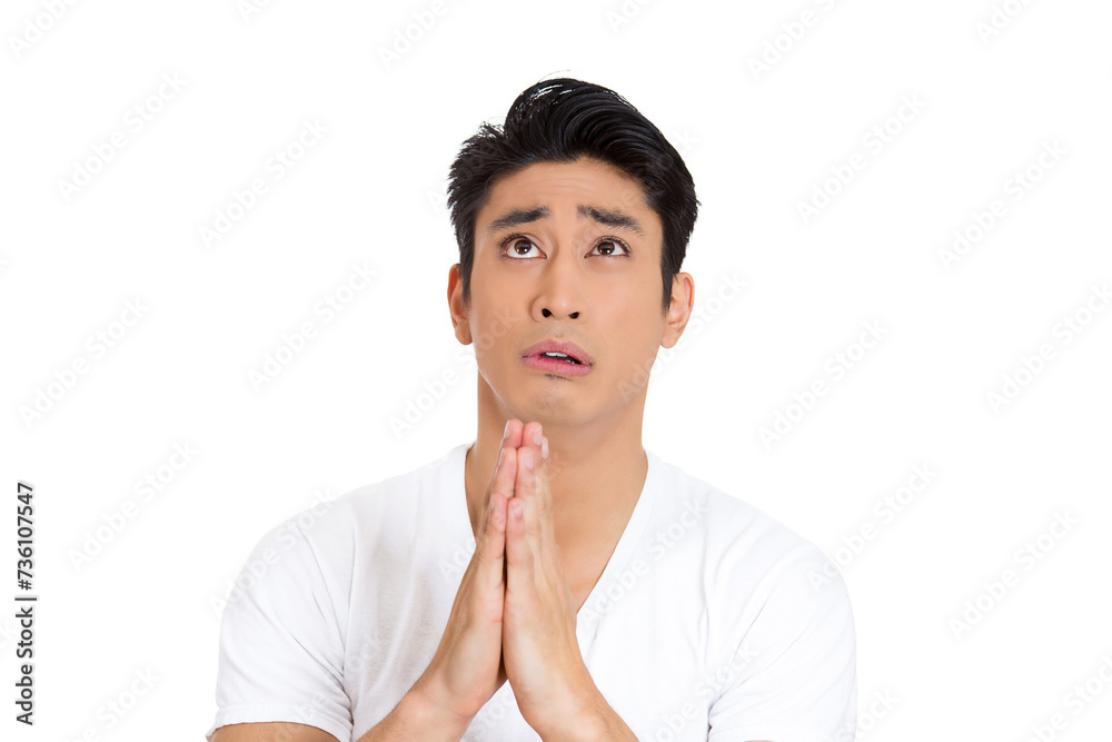 portrait of a young man praying hands clasped hoping for best asking for forgiveness or miracle isolated on white background portrait of a young man praying hands clasped hoping for best asking for forgiveness or miracle isolated on white background