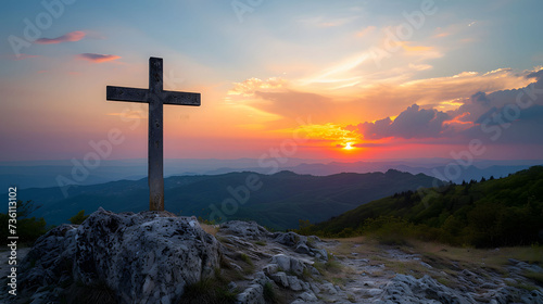 Cross Overlooking Mountain at Sunset