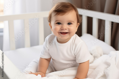 Children toddler in baby chair smiling and laughing. Cute 6 months toddler photo in light interior. Bright solid clothes. Happy baby, good eating. Baby care, happy parenting. Earle development.