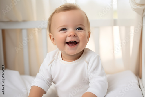 Children toddler in baby chair smiling and laughing. Cute 6 months toddler photo in light interior. Bright solid clothes. Happy baby, good eating. Baby care, happy parenting. Earle development.