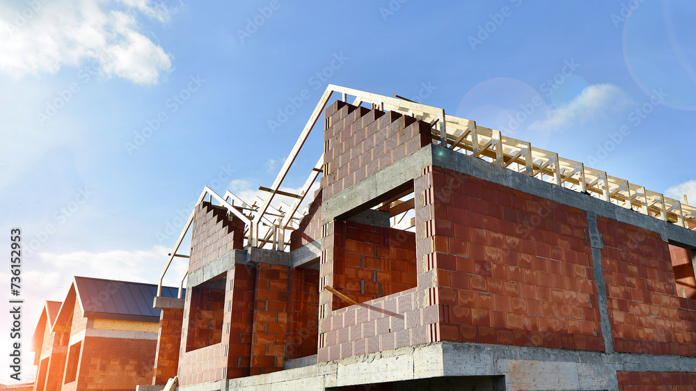 Obraz premium Single-family house under construction in an development estate of small single-family houses.