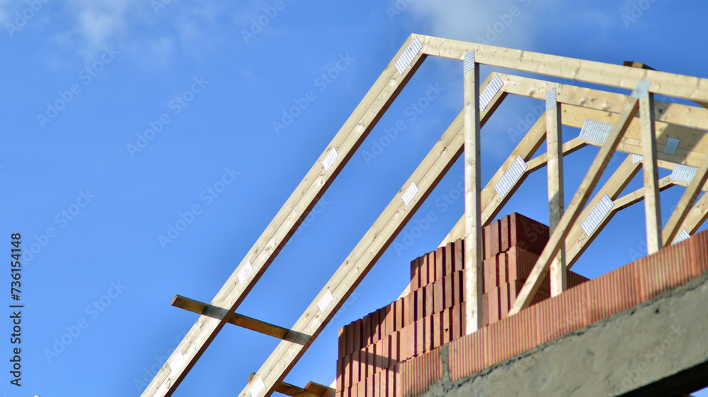 Single-family house under construction in an development estate of small single-family houses. Single-family house under construction in an development estate of small single-family houses.