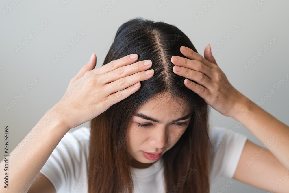 Hair loss problem, Asian woman look at scalp worry about balding. Hair loss problem, Asian woman look at scalp worry about balding.