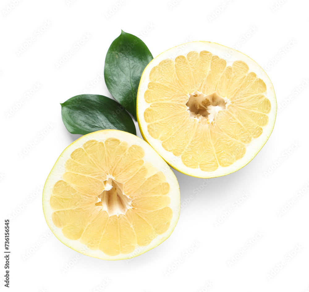 Halves of fresh pomelo fruit and leaves on white background Halves of fresh pomelo fruit and leaves on white background