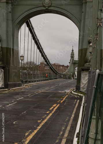 Hammersmith Bridge over the River Thames. One of the world's oldest suspension bridges and a major river crossing and primary route in west london, Space for text, Selective focus. photo