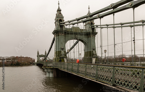 Hammersmith Bridge over the River Thames. One of the world's oldest suspension bridges and a major river crossing and primary route in west london, Space for text, Selective focus. photo