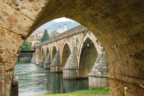 View of Mehmed Paša Sokolović Bridge in Višegrad, Bosnia and Herzegovina. Unesco world heritage site. Bridge over the Drina river. photo