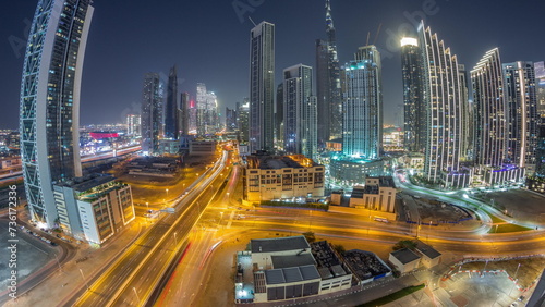 Aerial view of Dubai Downtown skyline with many towers day to night timelapse.