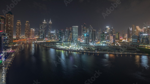 Panorama showing aerial view to Dubai Business Bay and Downtown with the various skyscrapers and towers night timelapse © neiezhmakov