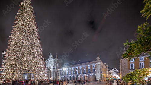 Panorama showing Commerce square illuminated and decorated at Christmas time in Lisbon night timelapse. Portugal