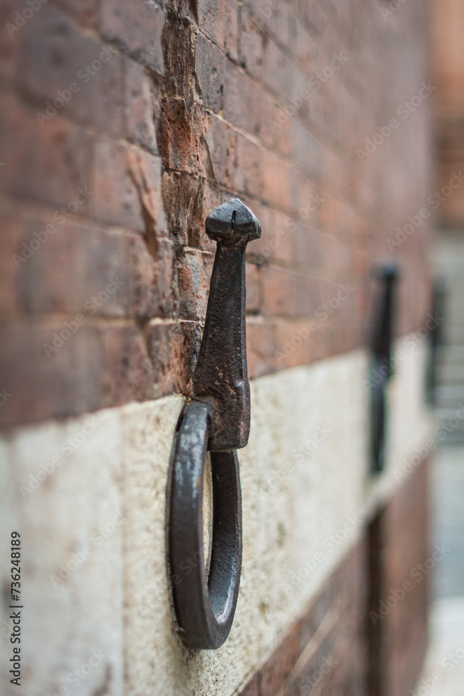 Iron ring on the building's wall in Siena, Italy Iron ring on the building's wall in Siena, Italy